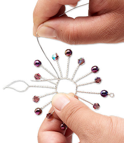 Looped twisted wire with beads